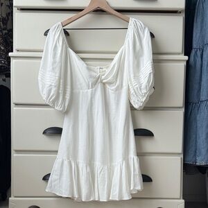 Saints Secrets twist front flounce dress